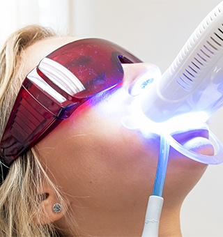 Patient receiving teeth whitening treatment