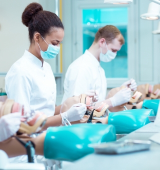 Dentists working in dental school lab