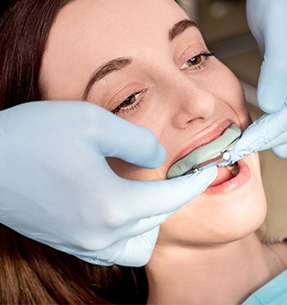 Woman receiving fluoride treatment