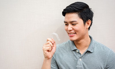 man holding Invisalign