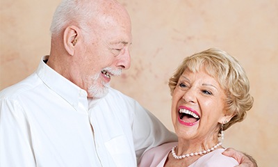 Older man and woman laughing