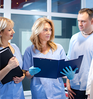 Dentists looking at patient chart