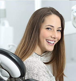 Smiling woman in dental chair